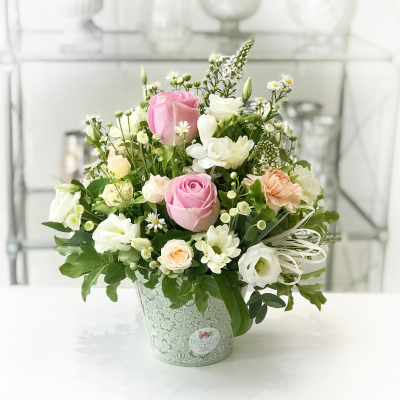 Pot of Happiness - A small but choice selection of flowers arranged in a petite container.